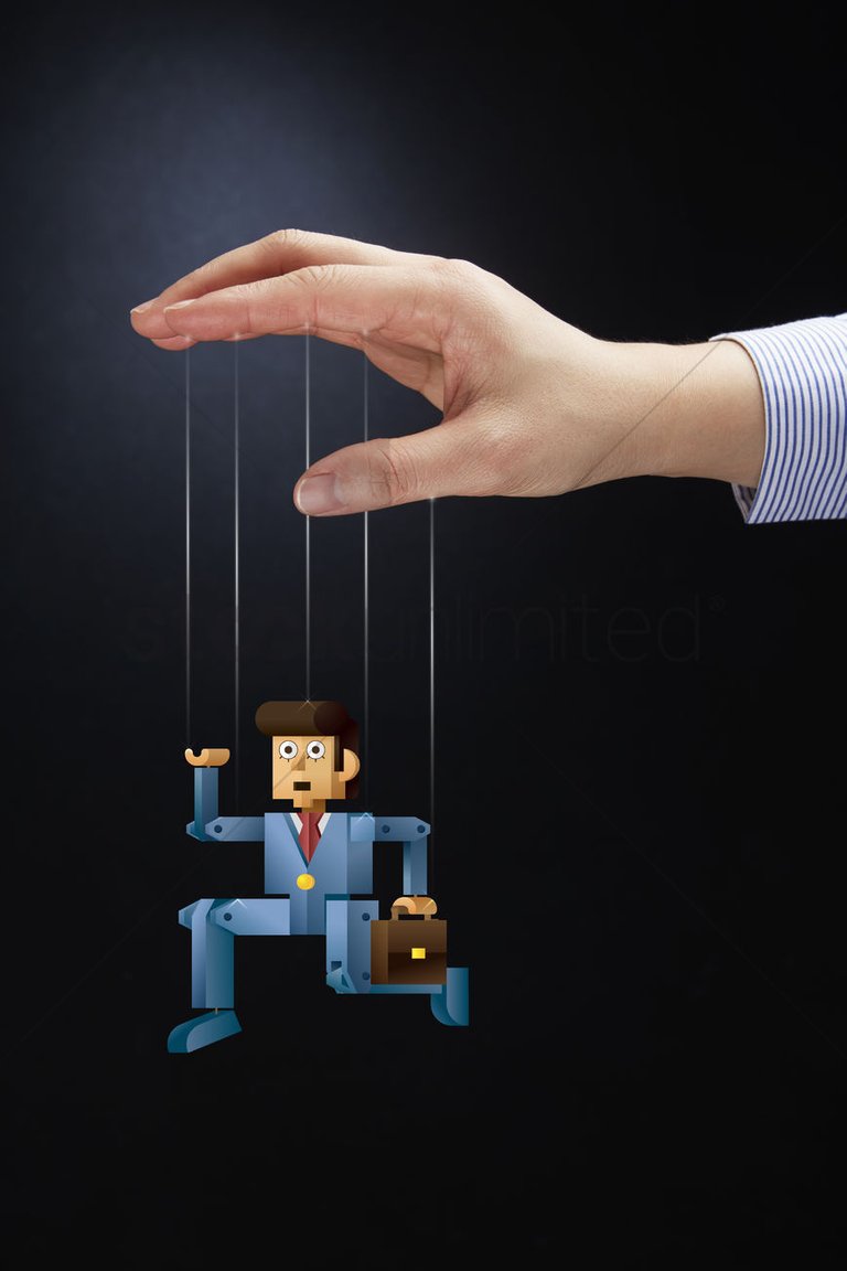 hand-puppeteering-a-businessman-puppet_1936775.jpg