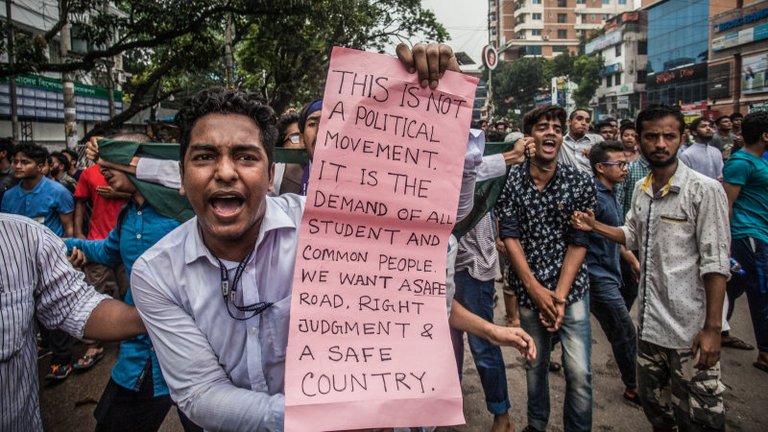 bangladeshi-students-march-along-a-street-during-a-student-protest-in-picture-id1011816026.jpg