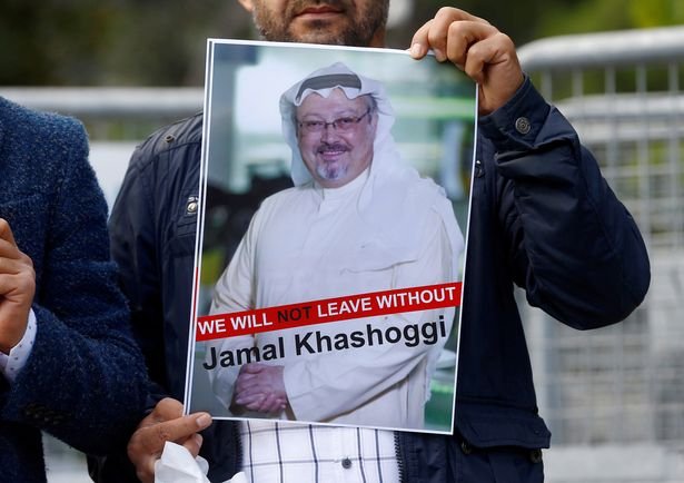 1_FILE-PHOTO-A-demonstrator-holds-picture-of-Saudi-journalist-Jamal-Khashoggi-during-1.jpg