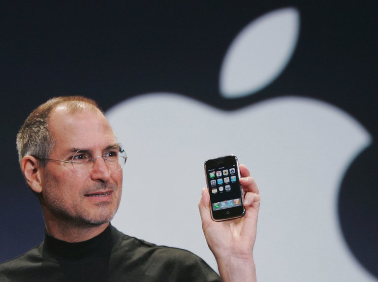 steve jobs with iphone.jpg