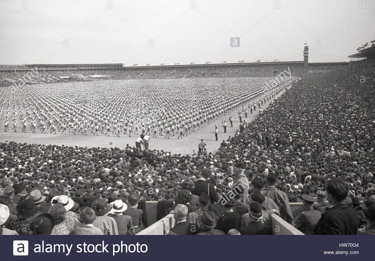 1938-historical-huge-crowds-at-the-giant-strahov-stadium-watch-a-mass-HW70G4.jpg