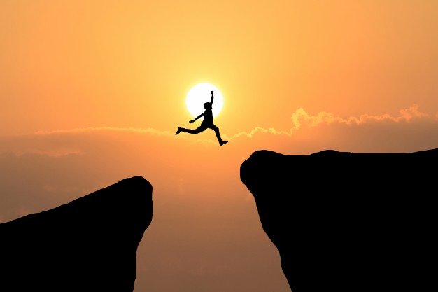 courage-man-jump-through-the-gap-between-hill-business-concept-idea_1323-262.jpg