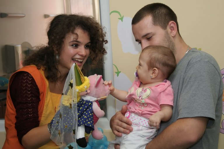 volunteers with child and parent.jpg