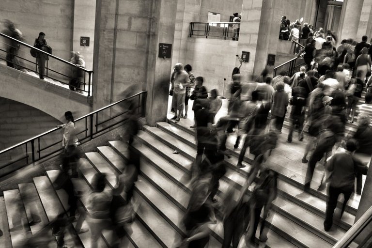 black-and-white-image-of-people-walking-in-underground.jpg