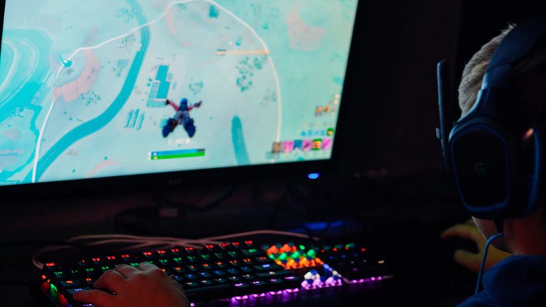 gamer-in-front-of-lit-up-keyboard-fortnite.jpg