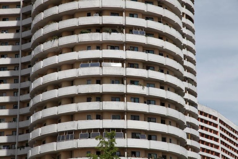 Solar panels facing the sun from balconies of an apartment building in Mangyongdae District, Pyongyang August 27, 2014. REUTERS.Staff.jpg