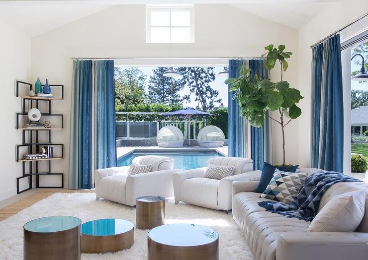 white-blue-living-room-tall-corner-bookcase-bookshelf.jpg