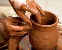 48624560-hands-of-a-potter-creating-an-earthen-jar.jpg