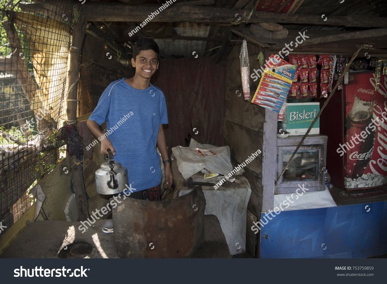 stock-photo-chirmiri-india-october-young-indian-smiling-boy-working-in-a-tea-stall-at-chirmiri-753759859.jpg