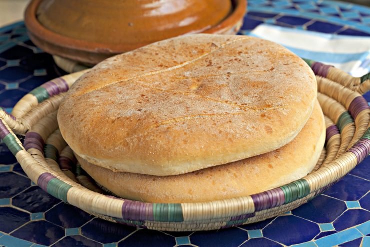 khobz-picturepartners-bigstock-Moroccan-bread-and-tagine-on-t-65143975-740x493.jpg