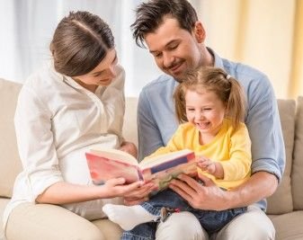 mom-and-dad-reading-to-kid-337x267.jpg