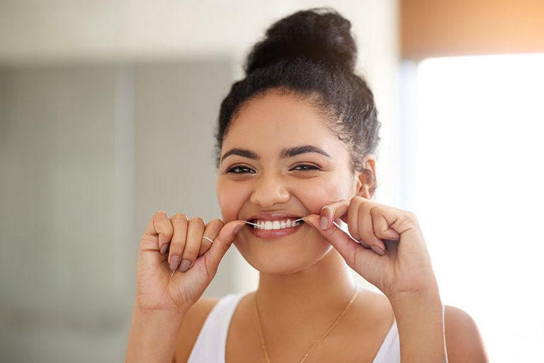 flossing-helps-clean-teeth-and-gums.jpg