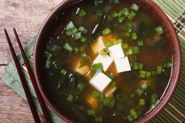 miso-soup-in-a-brown-bowl-close-up--horizontal-top-view-479541972-5a8f5bff3418c60037b42f4f.jpg