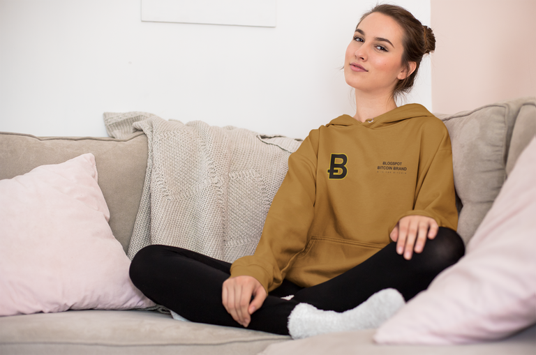 hoodie-mockup-of-a-young-woman-wearing-cozy-socks-on-a-couch-23203.png