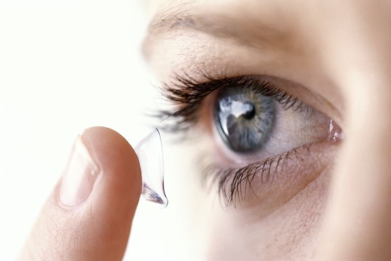 young-woman-putting-contact-lens-in-eye-high-res-stock-photography-10167238-1564409412.jpg