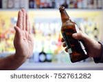 stock-photo-hand-rejecting-alcoholic-beer-beverage-concept-for-alcoholism-and-addiction-752761282.jpg