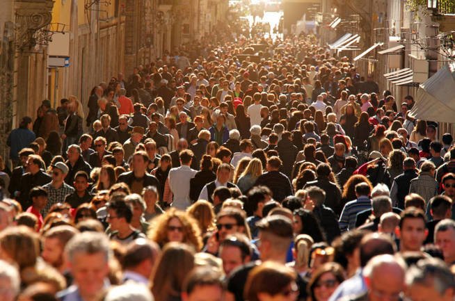 large-group-of-people-crowding-rome-s-downtown-streets-in-a-sunny-day-on-a-warm-day-the-historic-downtown-of-rome-italy-is-flooded-by-people-and-tourists-enjoying-monuments-and-famous-places-horizontal-compos.jpg