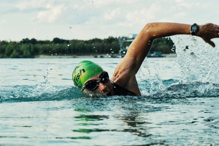 person-swimming-on-body-of-water-1415810.jpg