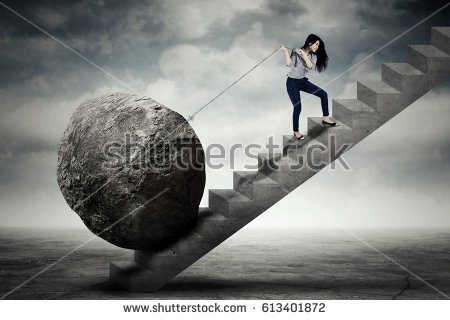 stock-photo-image-of-beautiful-female-entrepreneur-carrying-big-stone-with-a-chain-on-the-stair-613401872.jpg