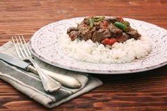 beef-stew-white-rice-sauce-wooden-background-93452279.jpg