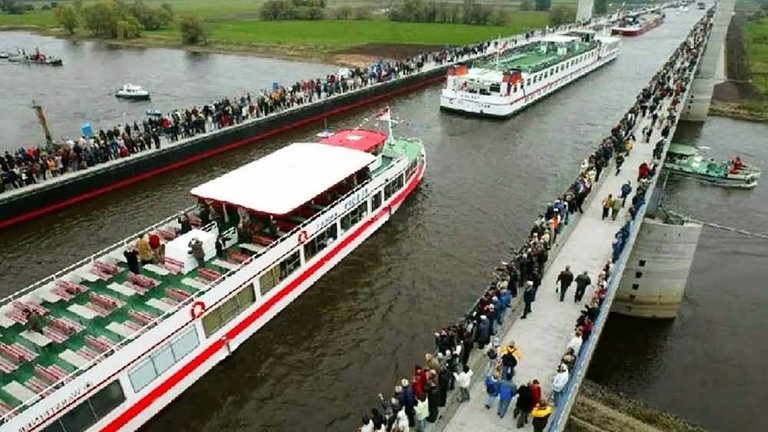 Visitors-Watching-The-Ships-Passing-From-The-Magdeburg-Water-Bridge-In-Germany.jpg