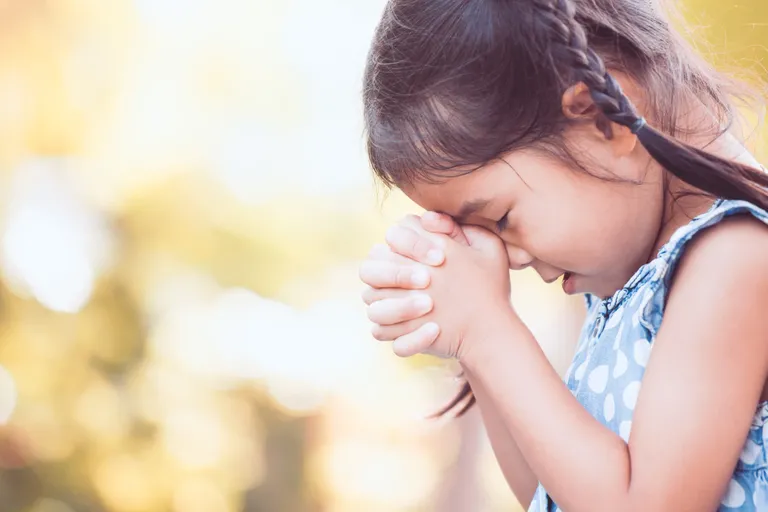 cute-asian-little-child-girl-praying-with-folded-her-hand-for-fa-scaled.webp