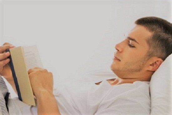 04-man-reading-book-in-bed.jpg