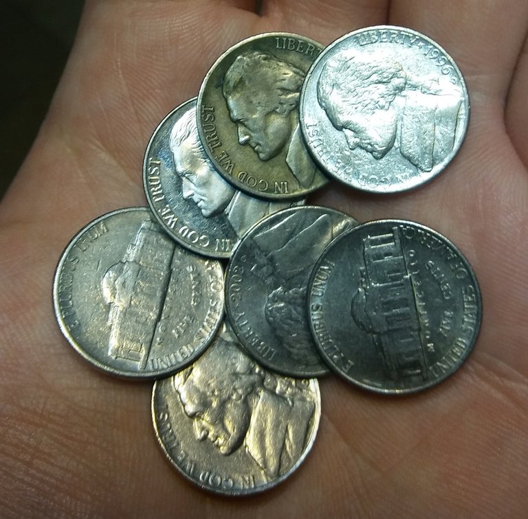 Pile of nickels with one silver nickel.jpg