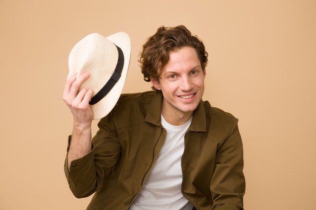 man-wearing-brown-dress-shirt-holding-white-fedora-hat-1036627 (1).jpg