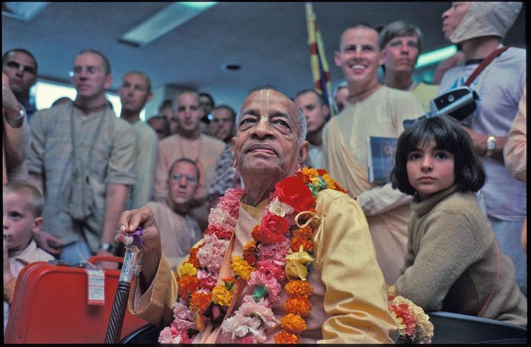 srila-prabhupada-with-devotees.jpg