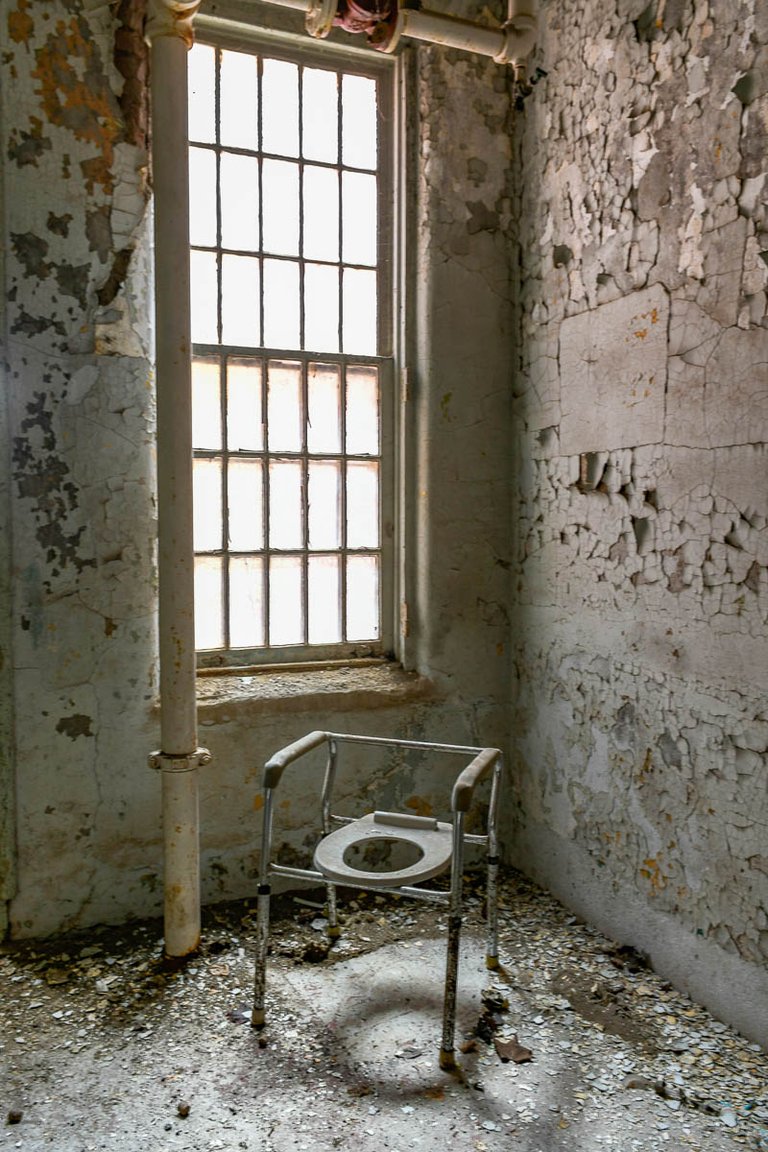 Commode Chair in abandoned psychiatric hospital.jpg