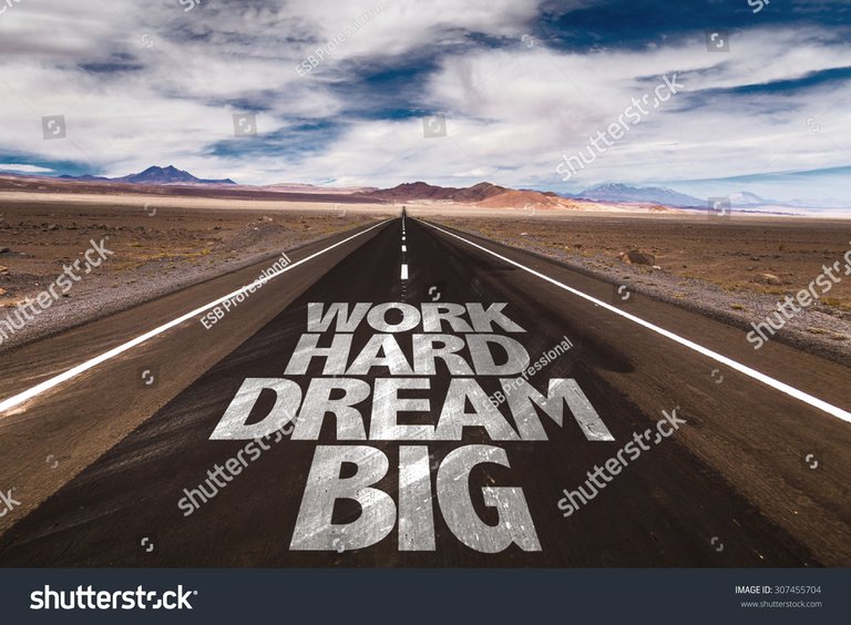 stock-photo-work-hard-dream-big-written-on-desert-road-307455704.jpg