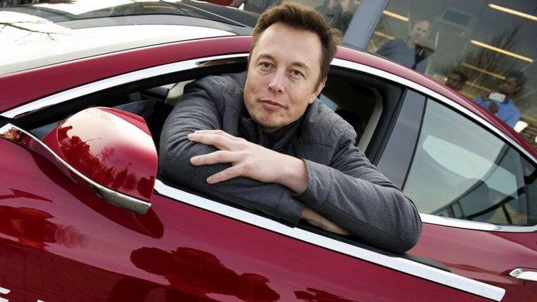 Elon-Musk-sitting-in-Tesla-car-shutterstock_8342395c-848x477.jpg