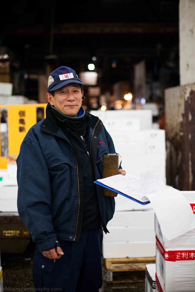 Photo+9.+Naofumi+Yamashita+wearing+hat+and+holds+clipboard16.jpg