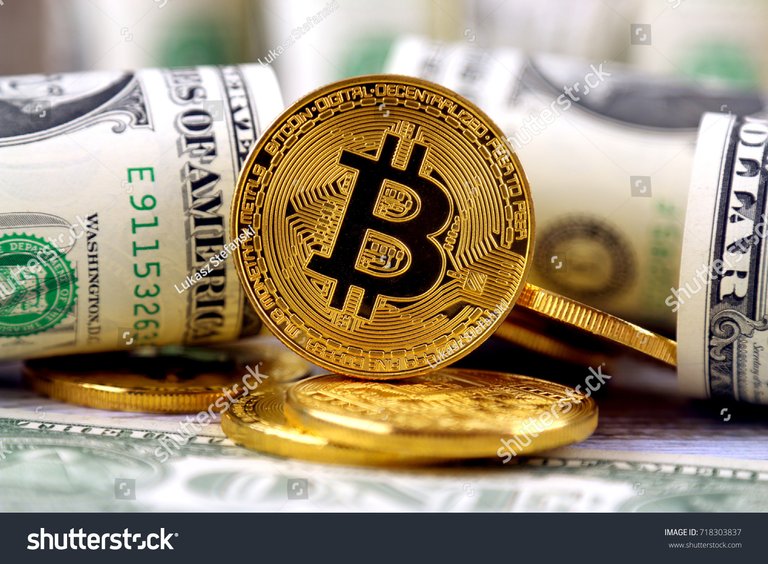 1 - stock-photo-physical-version-of-bitcoin-new-virtual-money-and-banknotes-of-one-dollar-exchange-bitcoin-for-a-718303837.jpg