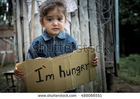 stock-photo-little-girl-holding-a-sheet-of-cardboard-on-the-cardboard-label-i-am-hungry-the-child-is-three-488066551.jpg