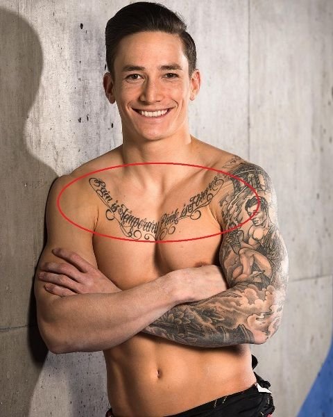 quote-on-chest-Marcel-Nguyen-tattoos.jpg