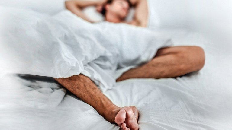 5963-Man_bed_asleep_legs-1296x728-Header.jpg