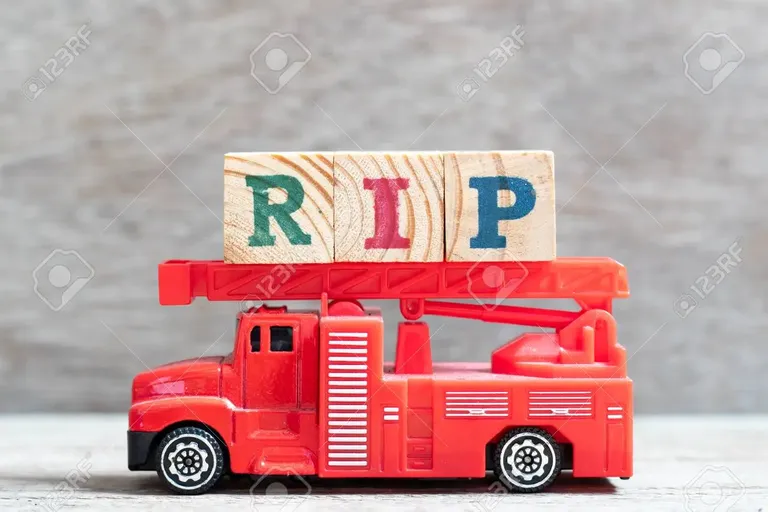 120808020-red-fire-truck-hold-letter-block-in-word-rip-abbreviation-of-rest-in-peace-on-wood-background.webp