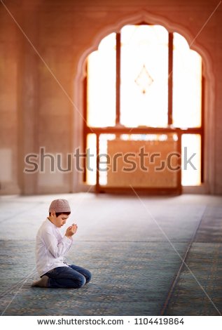 stock-photo-little-boy-praying-in-the-mosque-1104419864.jpg
