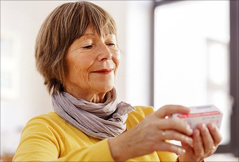 getty_rf_photo_of_woman_reading_drug_label.jpg