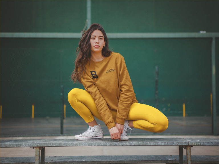 crewneck-sweatshirt-mockup-of-a-woman-crouching-on-a-steel-beam-a19049.png