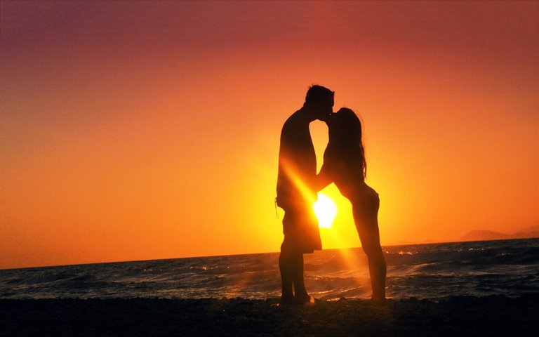 romantic-couple-kissing-in-evening-wide-59839176.jpg