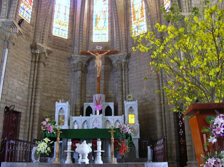 The alter and some of the impressive stained glass windows.jpg