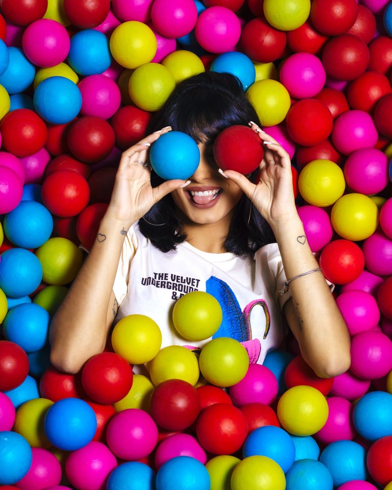 photo-of-woman-laying-on-assorted-colored-balls-3051598.jpg