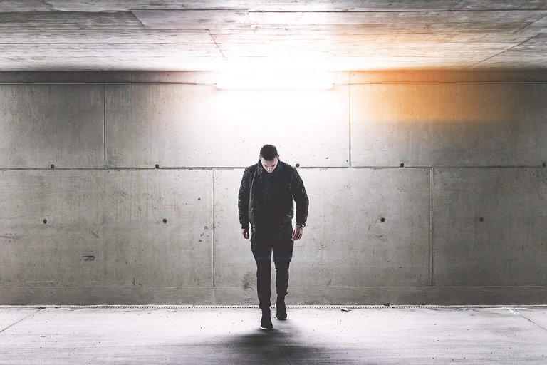 young-man-walking-in-conrete-underground-walkway_free_stock_photos_picjumbo_DSC02520-2210x1474.jpg