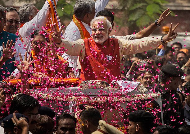 supporters-throw-flower-petals-as-bharatiya-janata-party-leader-modi-picture-id483540773.jpg