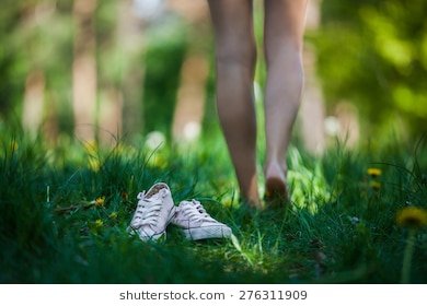 woman-walking-barefoot-on-green-260nw-276311909.jpg