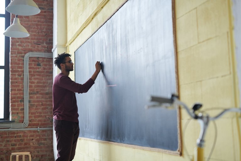 man-writing-on-a-blackboard-3184658.jpg