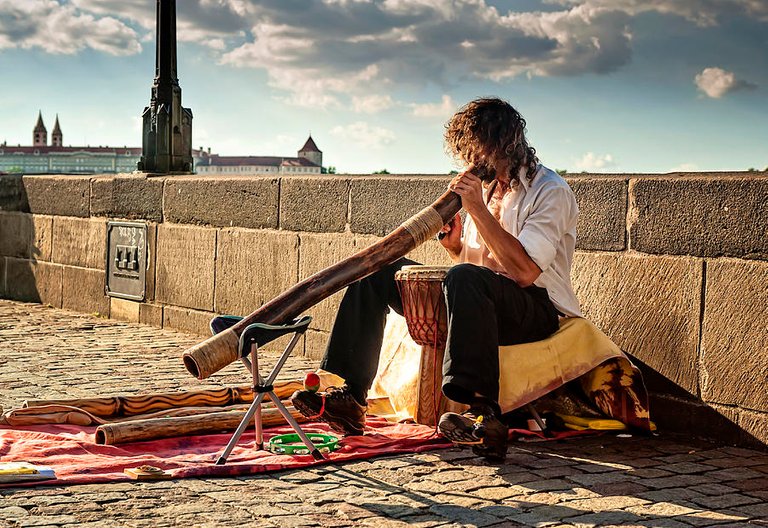 playing-didgeridoo-on-the-charles-bridge-prague-jenny-rainbow.jpg